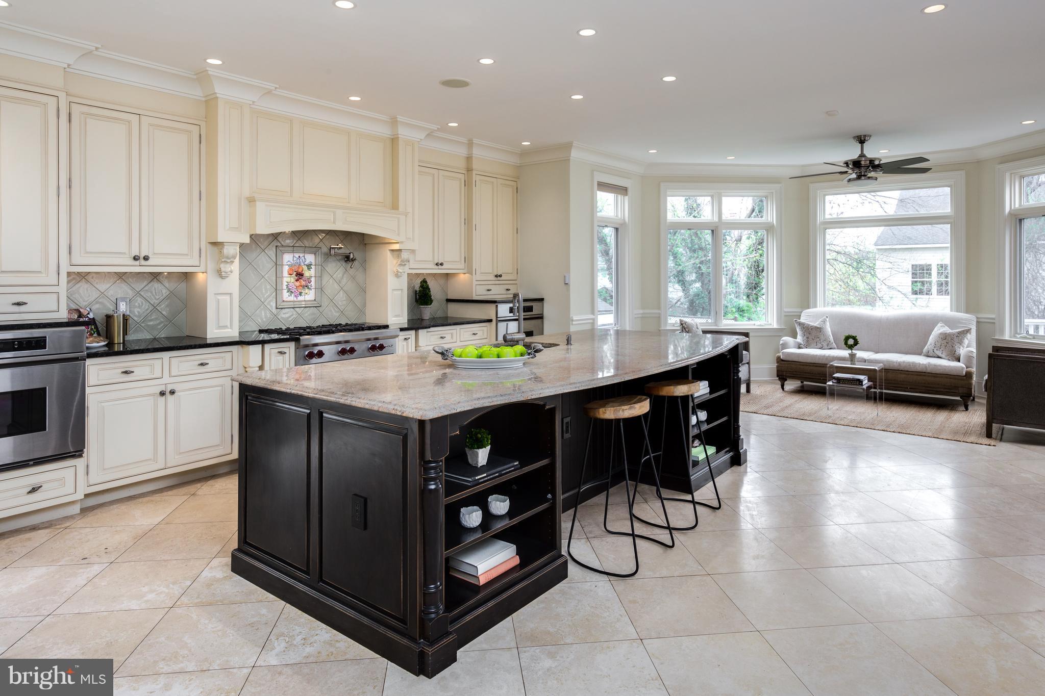 6802 Old Chesterbrook Road McLean, VA 22101 - Photo 13 of 30 a kitchen with a stove a sink and a refrigerator