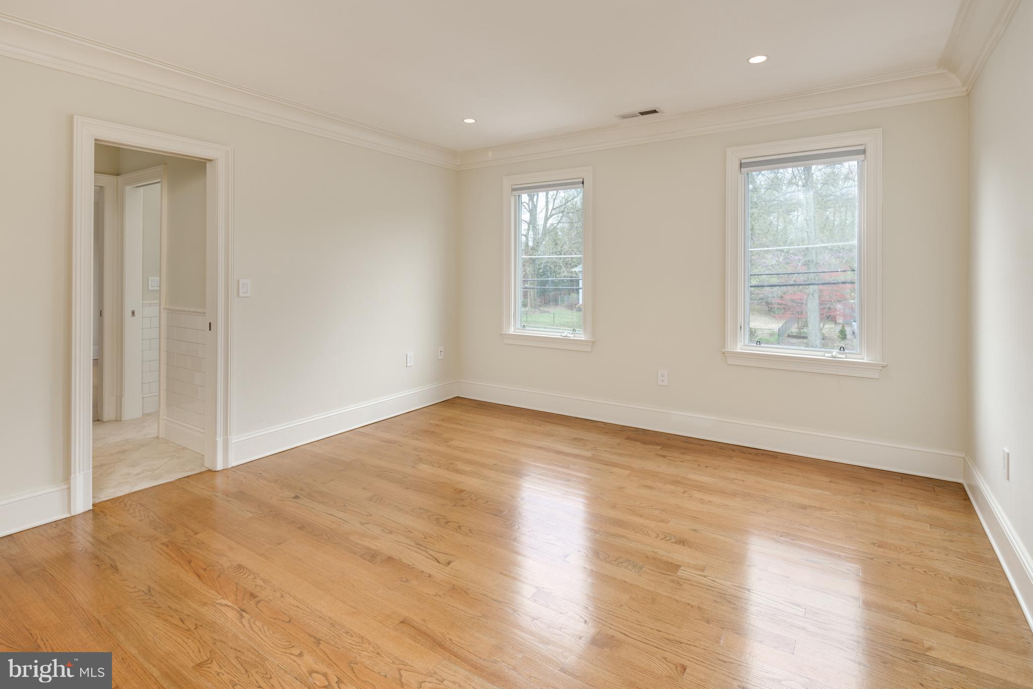 6802 Old Chesterbrook Road McLean, VA 22101 - Photo 22 of 30 a view of an empty room with wooden floor and a window