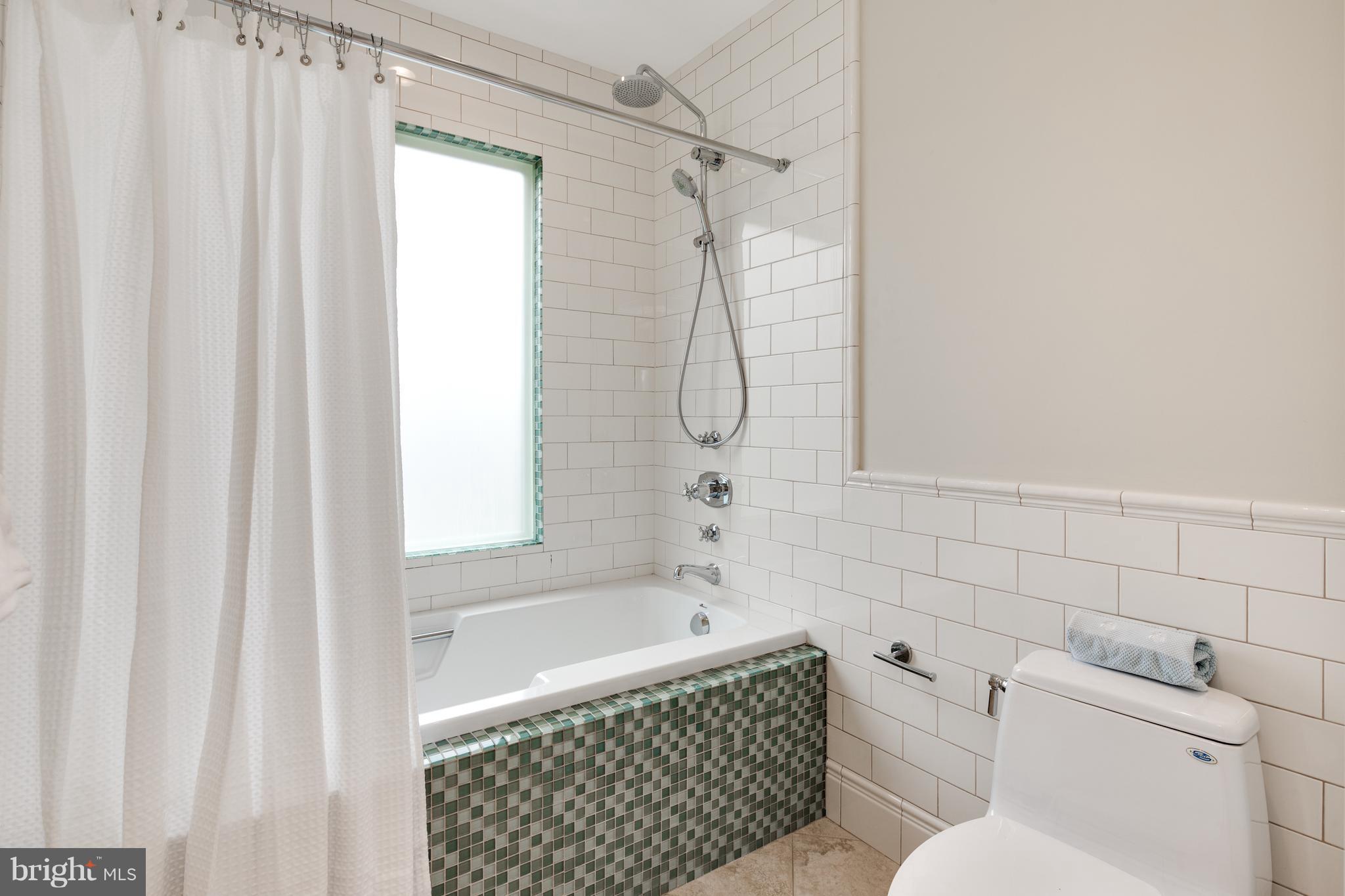 6802 Old Chesterbrook Road McLean, VA 22101 - Photo 24 of 30 a bathroom with a sink a toilet and a bathtub