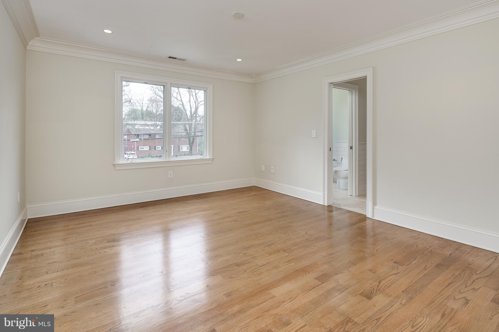 6802 Old Chesterbrook Road McLean, VA 22101 - Photo 25 of 30 an empty room with wooden floor and windows