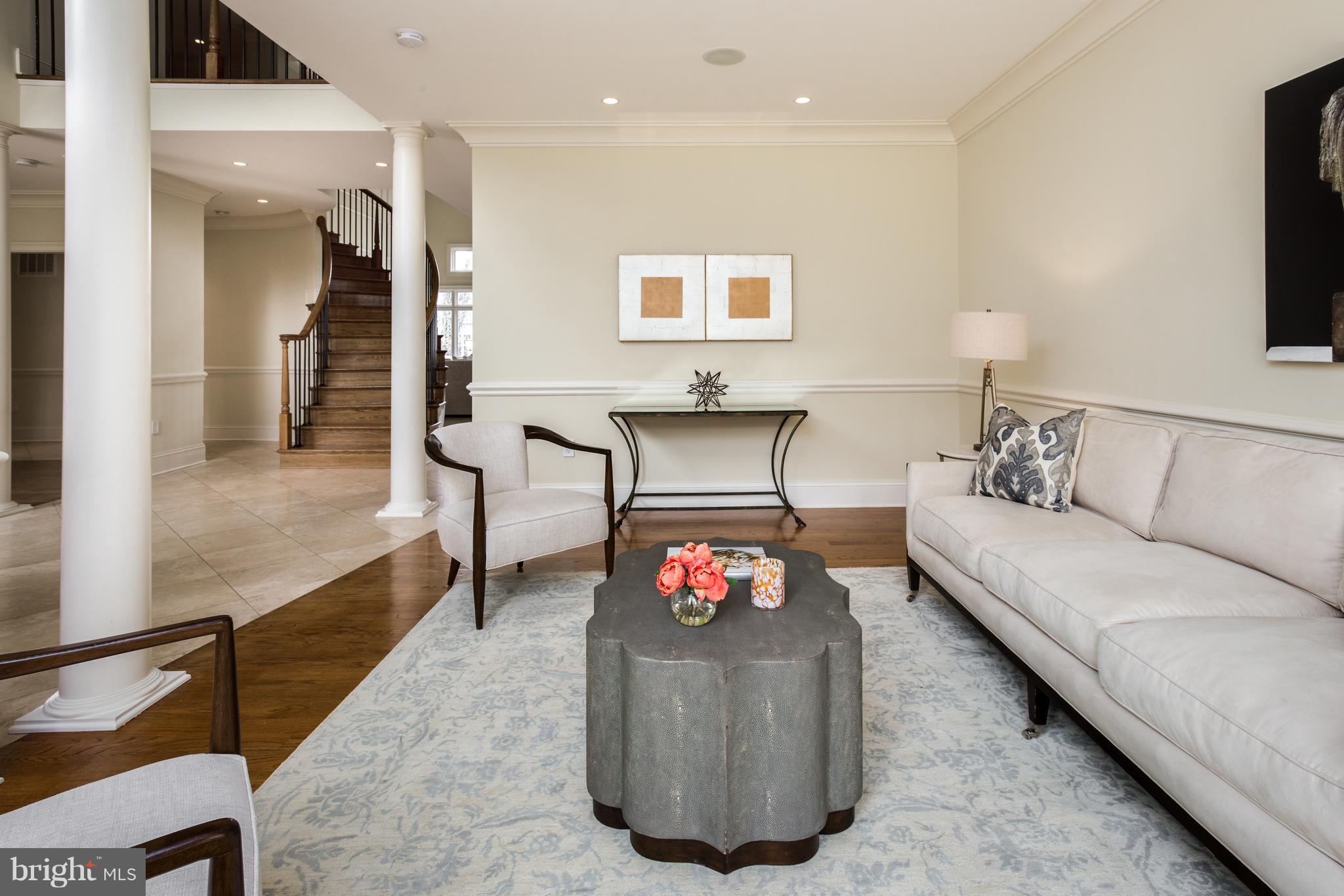 6802 Old Chesterbrook Road McLean, VA 22101 - Photo 5 of 30 a living room with furniture and a flat screen tv