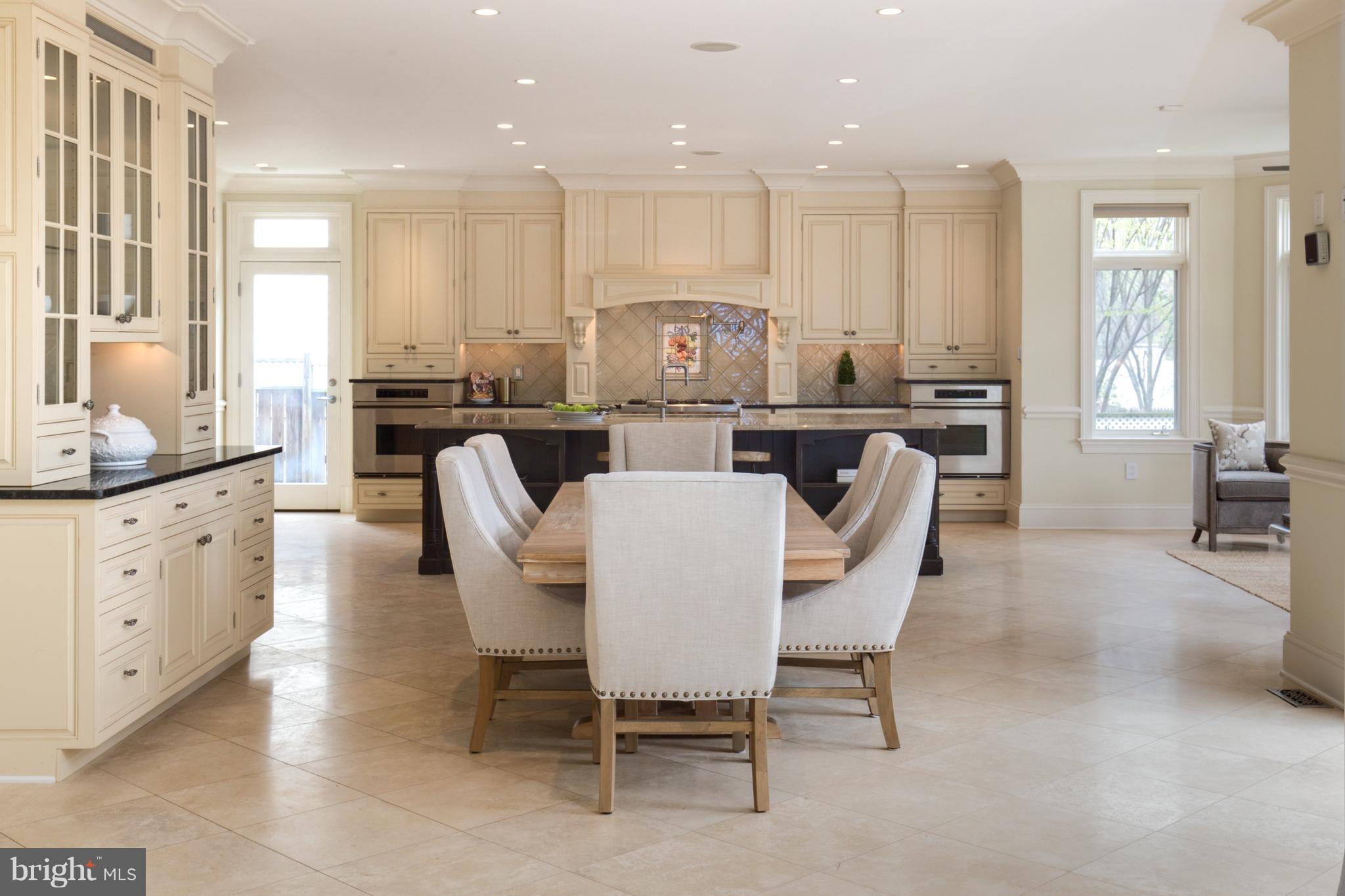 6802 Old Chesterbrook Road McLean, VA 22101 - Photo 9 of 30 a large kitchen with a table and chairs
