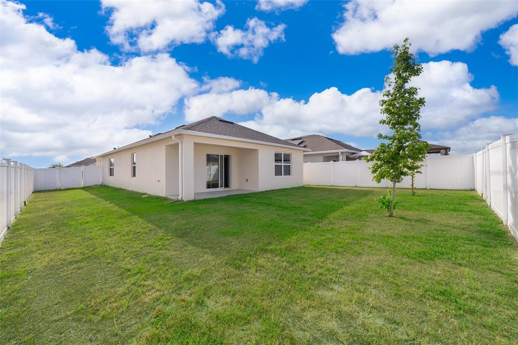 1500 Quinta Road Kissimmee, FL 34744 - Photo 23 of 34 a view of a house with a backyard