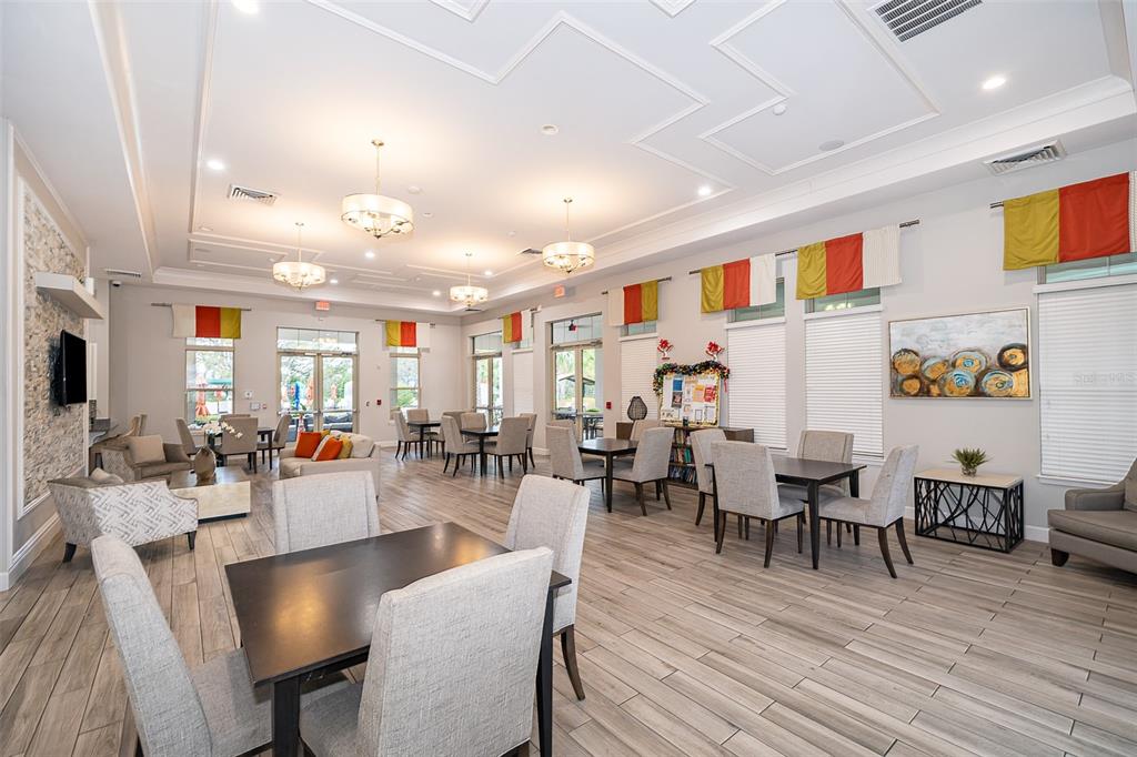 1500 Quinta Road Kissimmee, FL 34744 - Photo 28 of 34 a view of a dining room with furniture wooden floor and chandelier