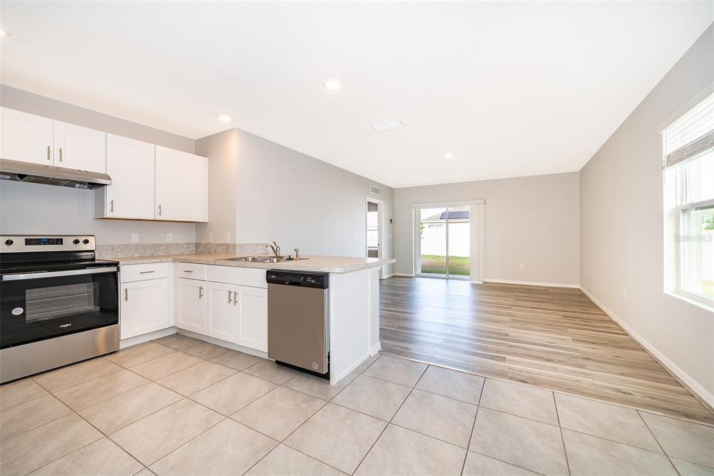 1500 Quinta Road Kissimmee, FL 34744 - Photo 4 of 34 a kitchen with a sink cabinets and window