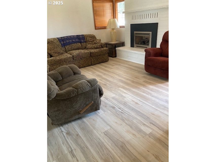 3107 Southwest Ladow Avenue Pendleton, OR 97801 - Photo 2 of 34 a living room with furniture and a fireplace