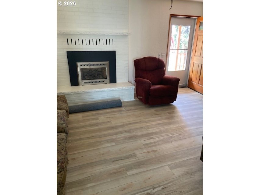 3107 Southwest Ladow Avenue Pendleton, OR 97801 - Photo 3 of 34 a living room with furniture and a fireplace