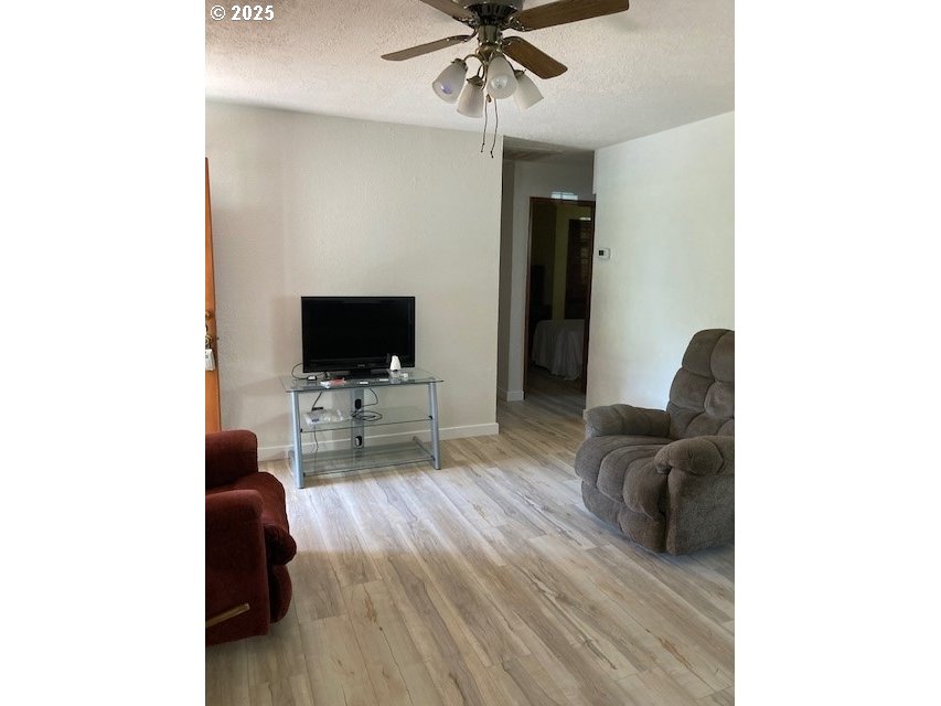 3107 Southwest Ladow Avenue Pendleton, OR 97801 - Photo 5 of 34 a living room with furniture and a flat screen tv