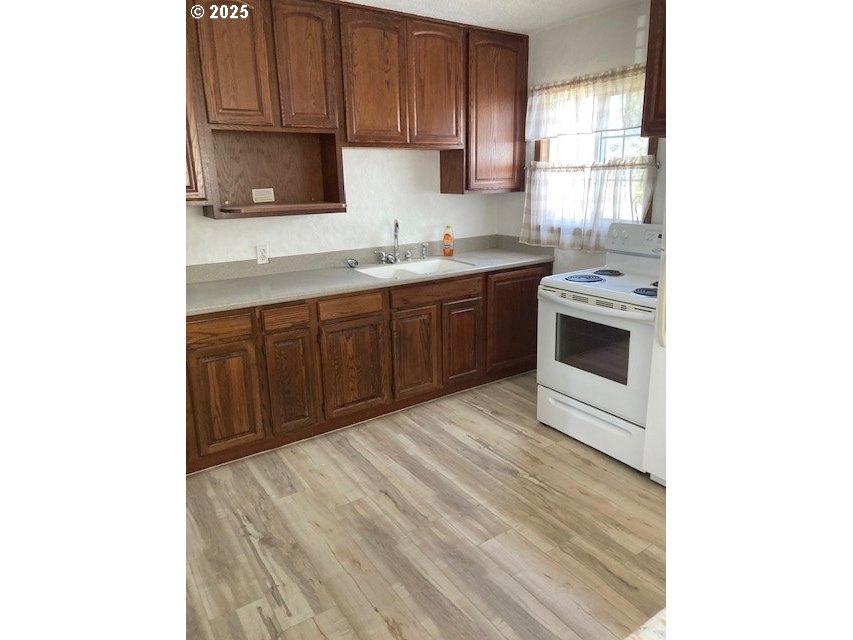 3107 Southwest Ladow Avenue Pendleton, OR 97801 - Photo 6 of 34 a kitchen with a sink cabinets and window