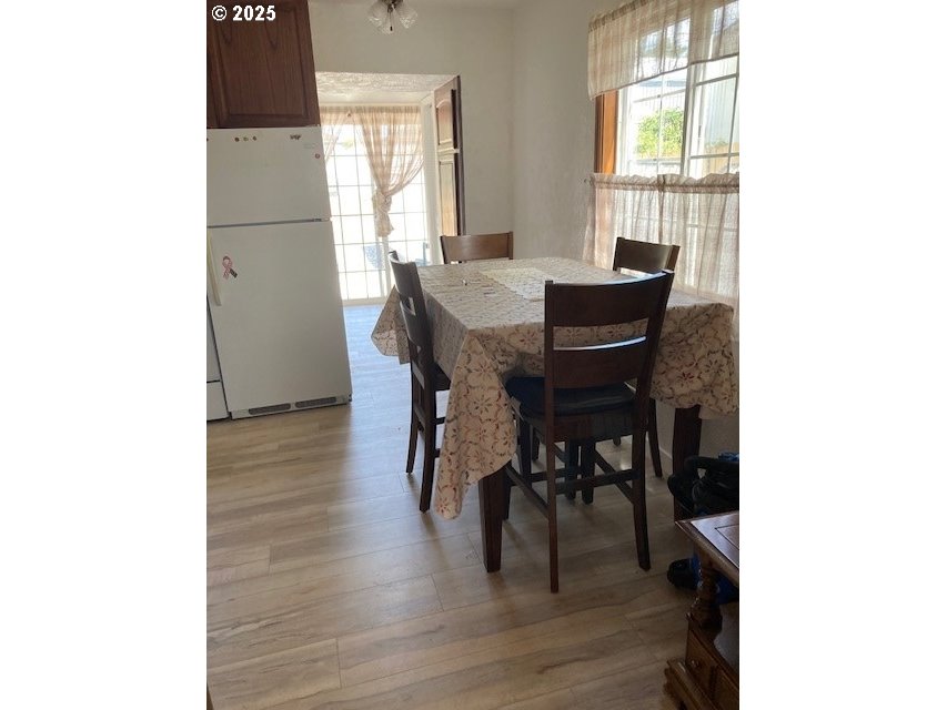 3107 Southwest Ladow Avenue Pendleton, OR 97801 - Photo 9 of 34 a view of a dining room with furniture and wooden floor