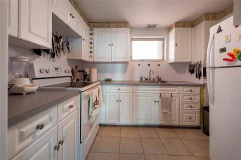 a spacious bedroom with a bed and a window