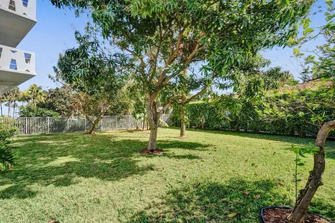 a view of swimming pool with a house
