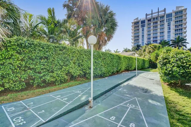 a view of swimming pool with a house