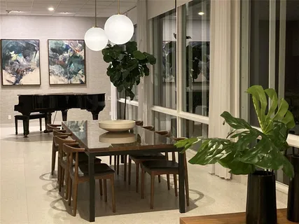a living room with large lots of books on the wall