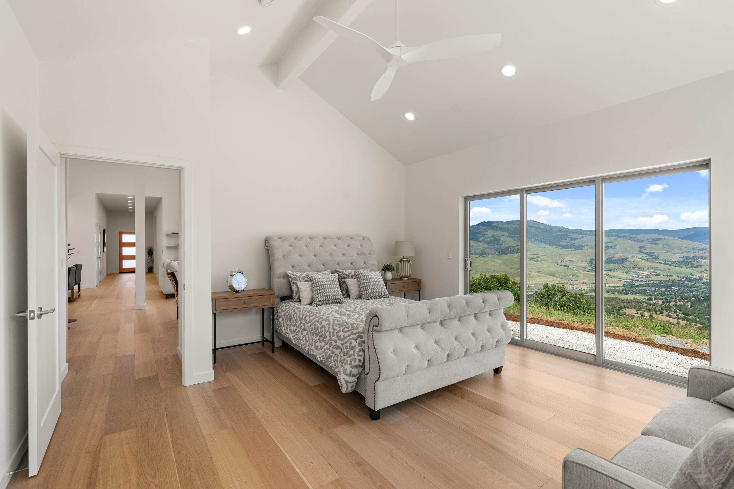3060 Ashland Mine Road Talent, OR 97540 - Photo 18 of 43 a spacious bedroom with a bed and a large window