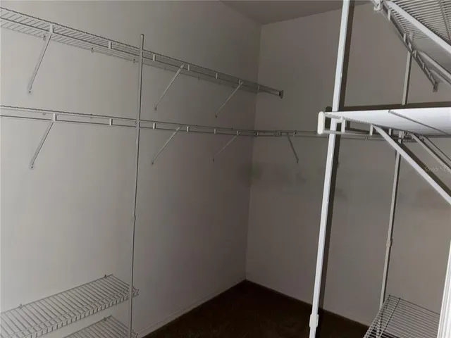 a view of a room with racks on the wall