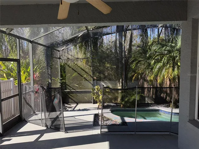 a view of entryway with a floor to ceiling window with wooden fence