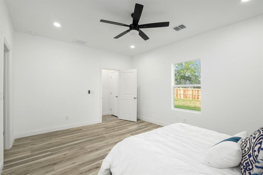 228 Windjammer Road Gun Barrel City, TX 75156 - Photo 12 of 19 a bedroom with a bed and a window