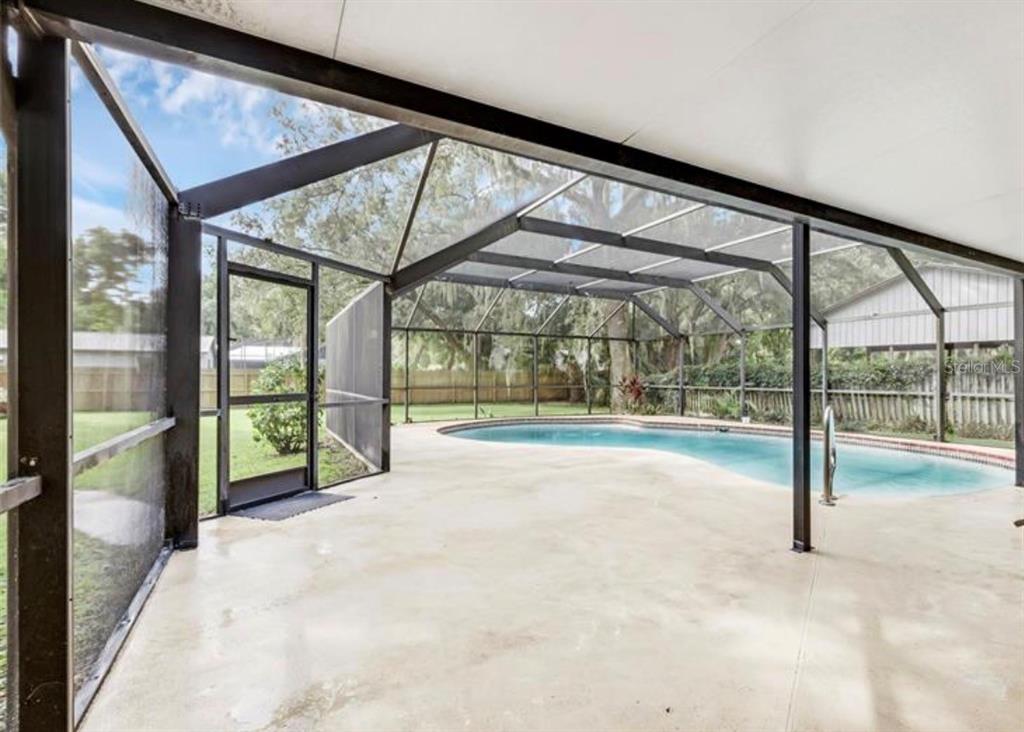 4308 Allen Road Fruitland Park, FL 34731 - Photo 26 of 33 a view of an empty room with a floor to ceiling window