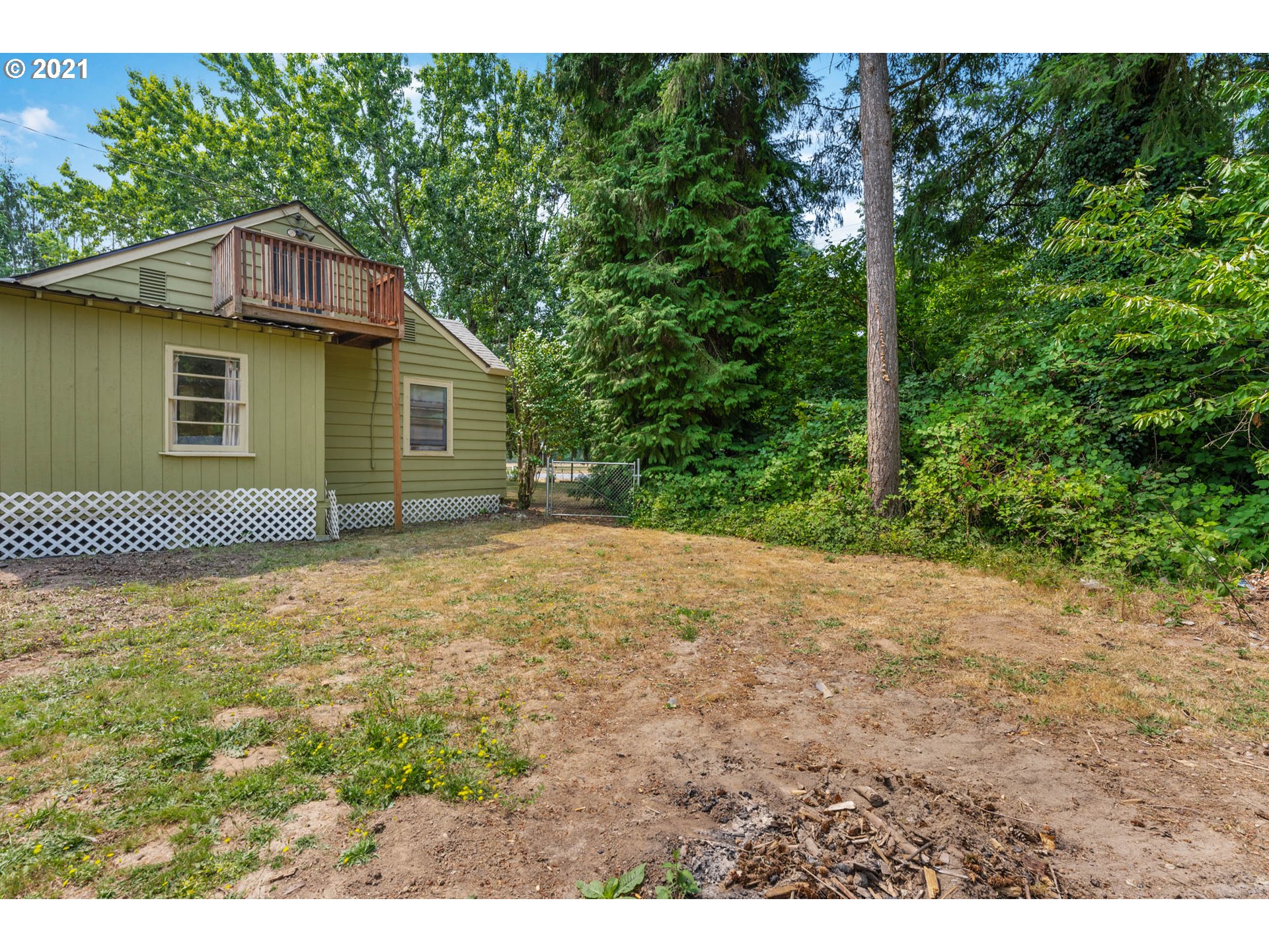 1006 Northeast 194th Street Ridgefield, WA 98642 - Photo 23 of 32 a view of a house with a yard and garage