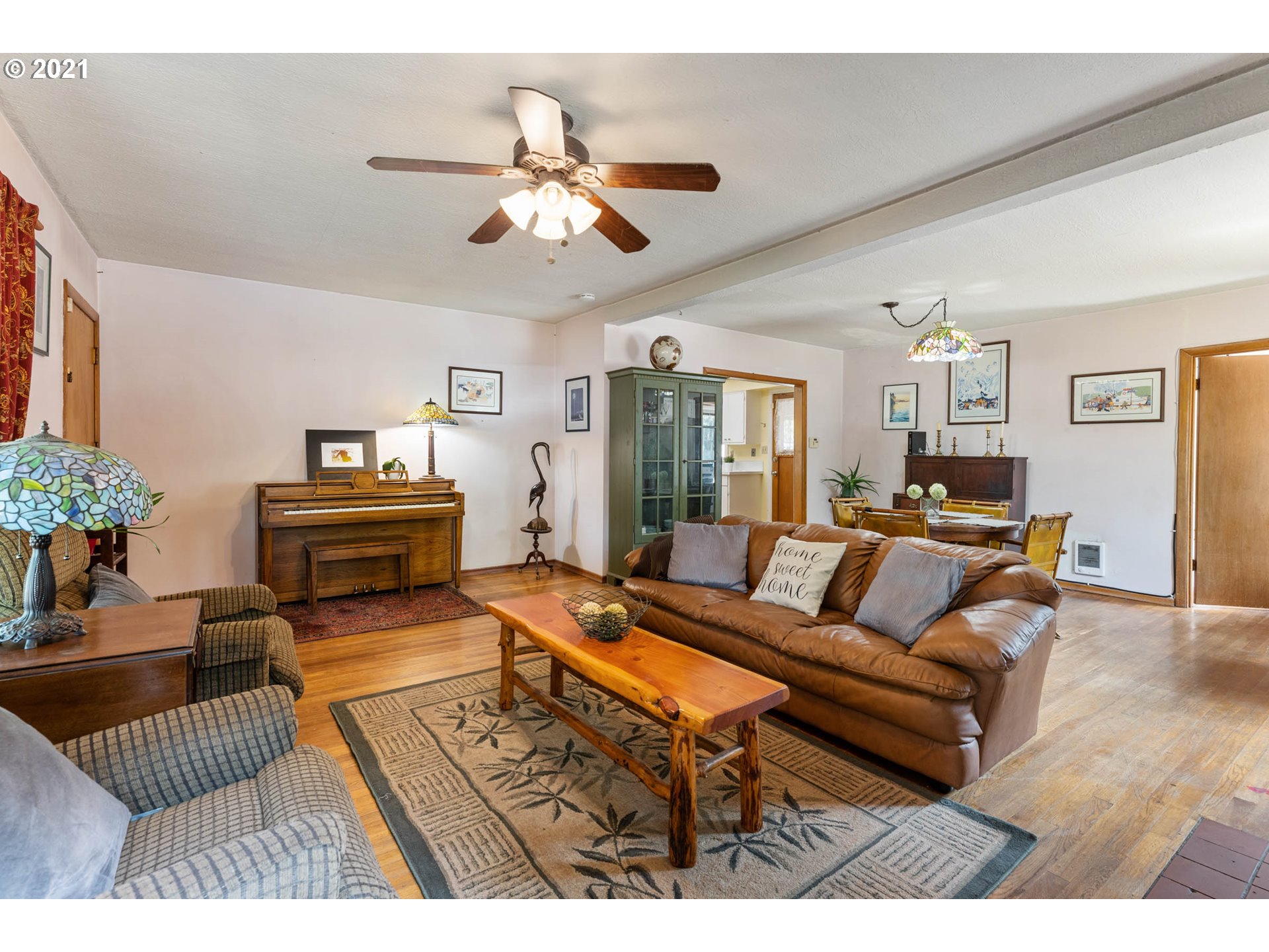1006 Northeast 194th Street Ridgefield, WA 98642 - Photo 6 of 32 a living room with furniture and a chandelier