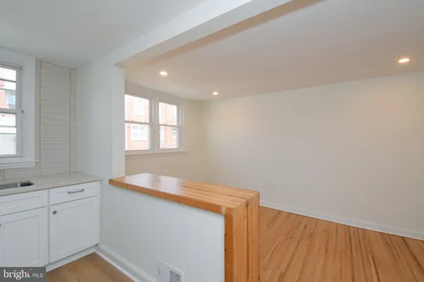 a bathroom with a sink and a window