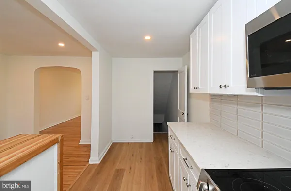 a kitchen with a sink and a refrigerator