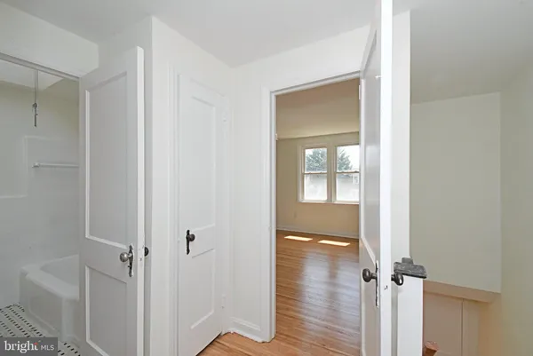 a view of a bathroom from a hallway