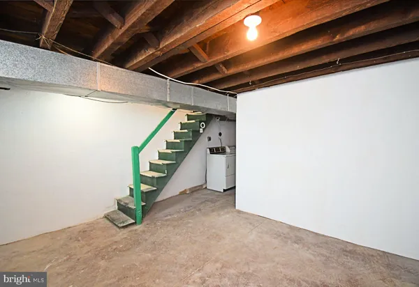 a view of an empty room with stairs