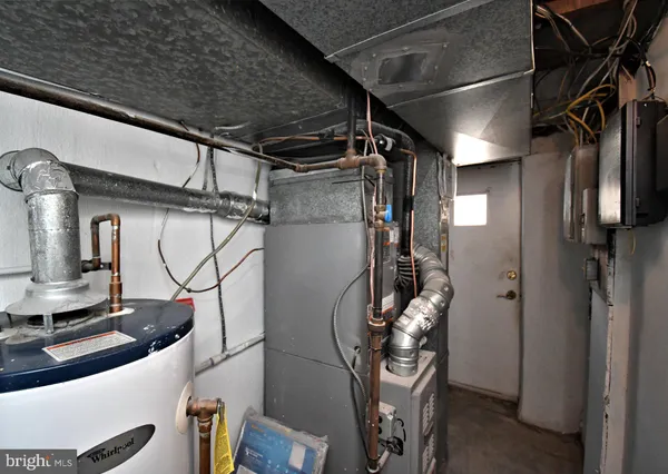 a utility room with lots of racks on the wall
