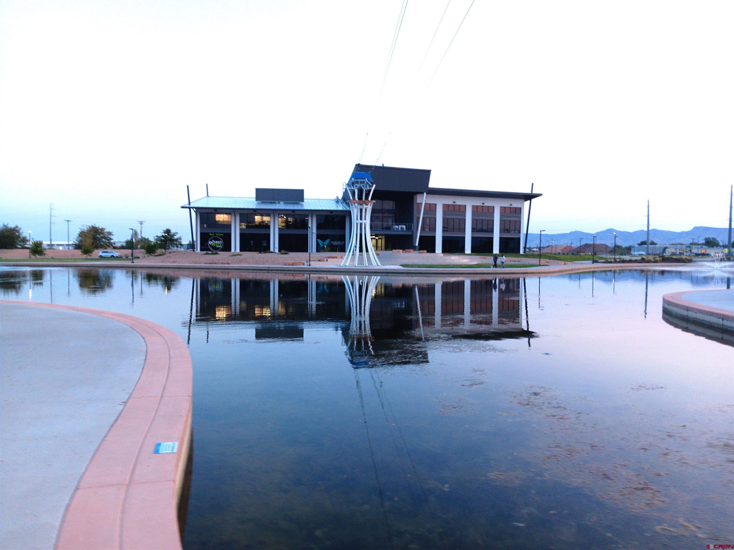 1601 Riverfront Drive, Unit 101 Grand Junction, CO 81501 - Photo 4 of 9 a view of a roof deck with couches and wooden floor