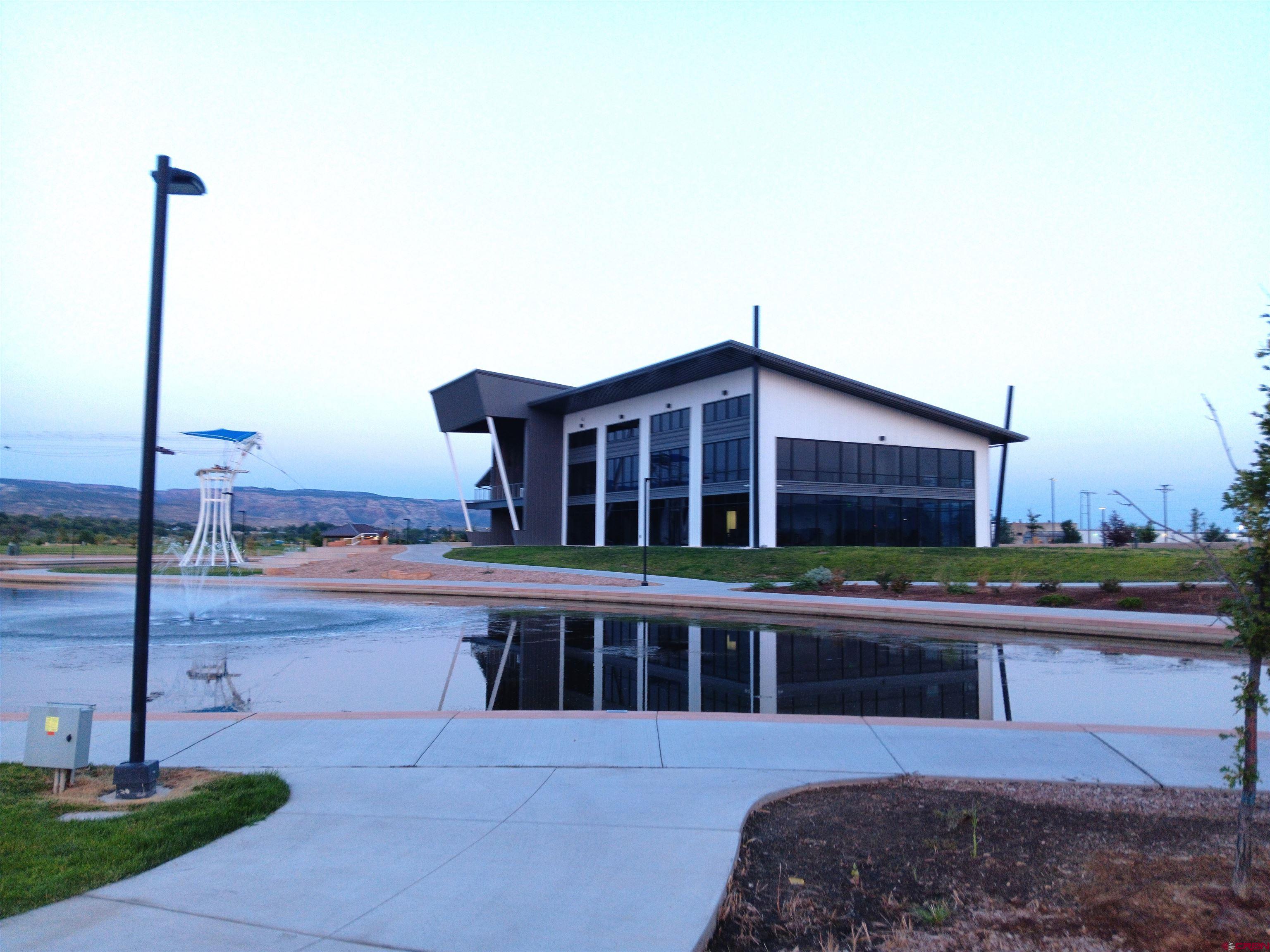 1601 Riverfront Drive, Unit 101 Grand Junction, CO 81501 - Photo 5 of 9 a view of a house with a yard and sitting area
