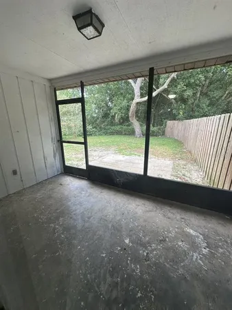 a view of a room with large windows