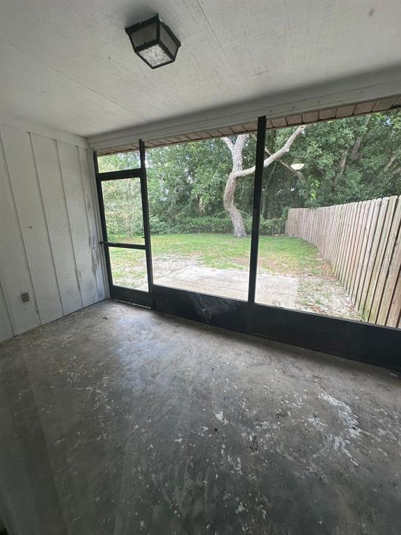 8085 Omaha Circle Spring Hill, FL 34606 - Photo 15 of 18 a view of a room with large windows