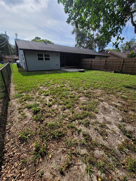 8085 Omaha Circle Spring Hill, FL 34606 - Photo 18 of 18 a view of a house with a yard