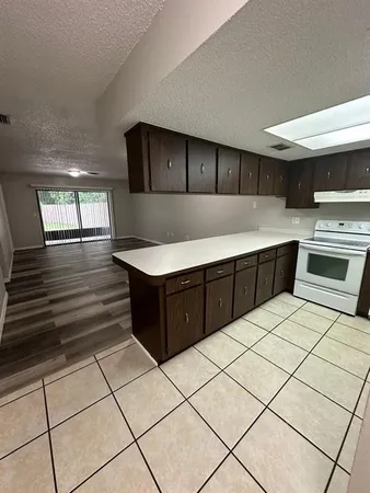 a kitchen with stainless steel appliances a sink and counter space