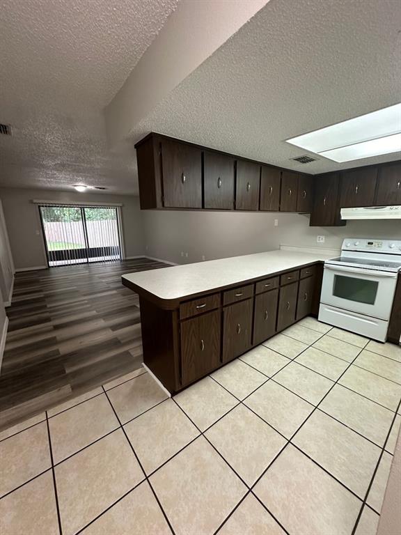 8085 Omaha Circle Spring Hill, FL 34606 - Photo 6 of 18 a kitchen with stainless steel appliances a sink and counter space