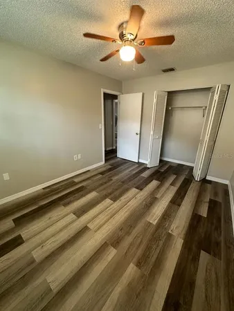a view of room with a ceiling fan