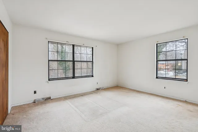 an empty room with windows