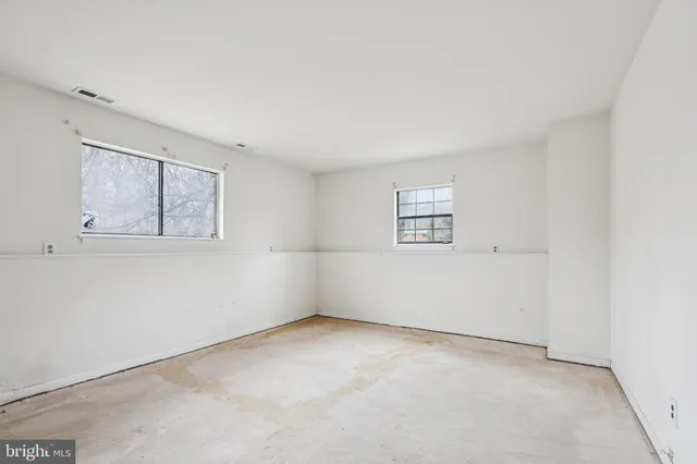 an empty room with windows