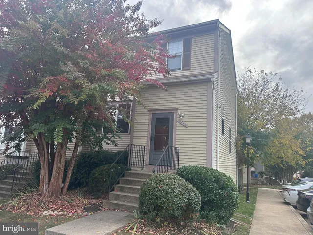 a front view of a house with yard