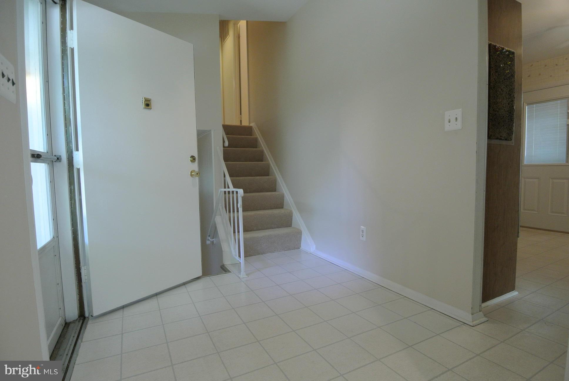 3906 Setonhurst Road Baltimore, MD 21208 - Photo 8 of 30 a view of a hallway with wooden floor and entryway