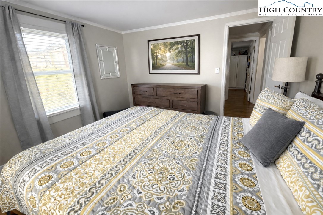 230 Beaver Creek Road West Jefferson, NC 28694 - Photo 14 of 20 a bedroom with a bed and a window