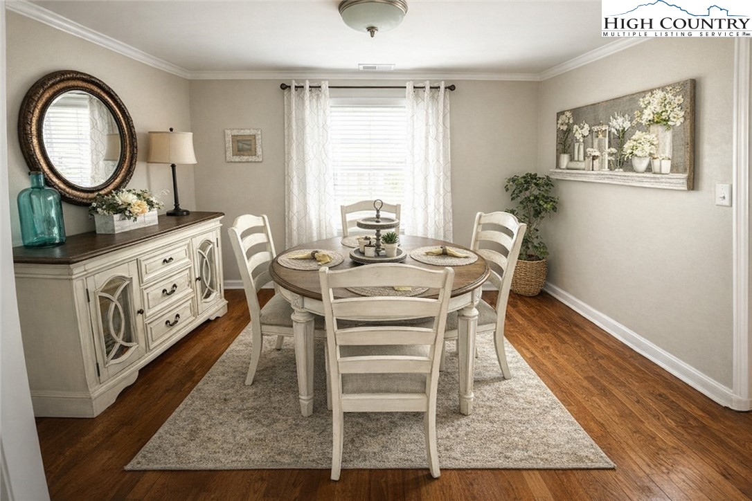 230 Beaver Creek Road West Jefferson, NC 28694 - Photo 6 of 20 a dining room with furniture a rug and a window