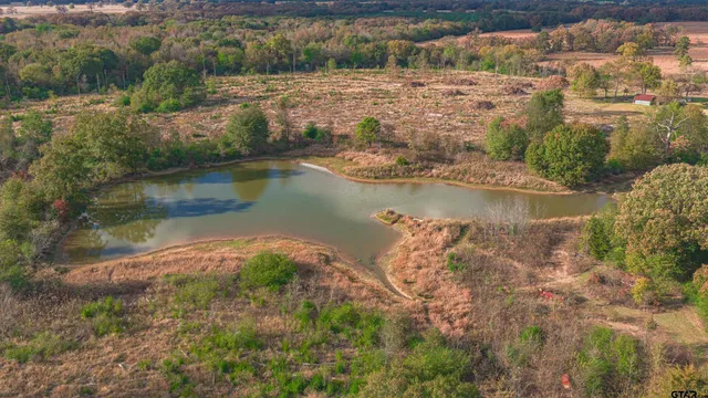a view of a lake with a yard