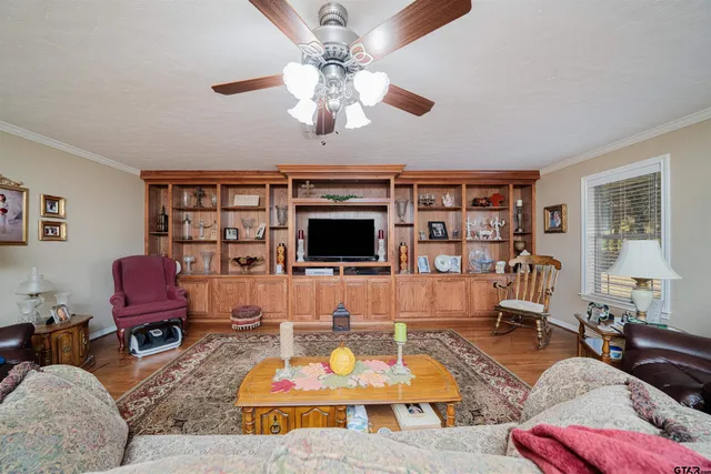 a living room with furniture and a flat screen tv