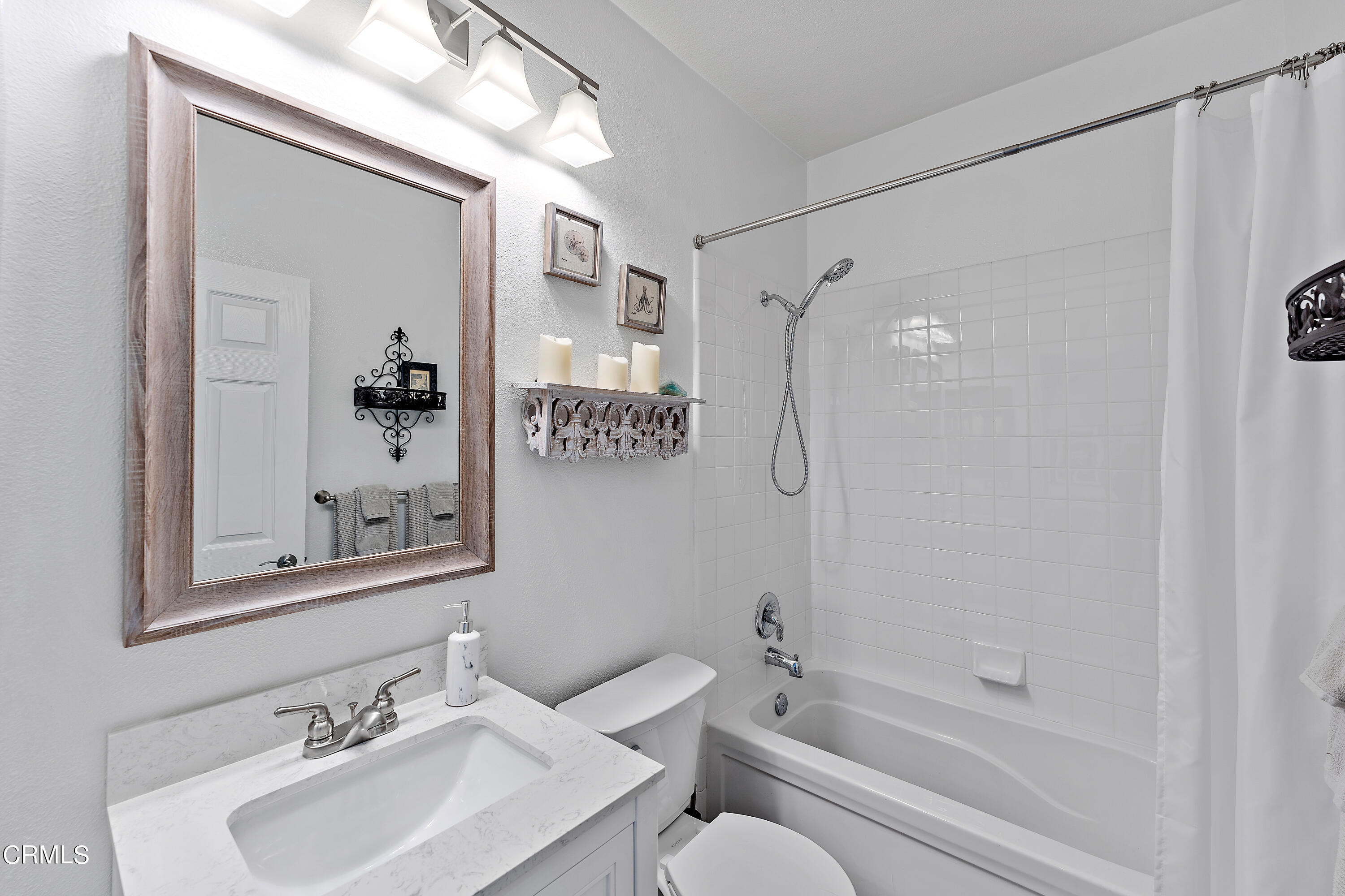 1239 Bayside Lane Oxnard, CA 93035 - Photo 13 of 27 a bathroom with a sink toilet and shower