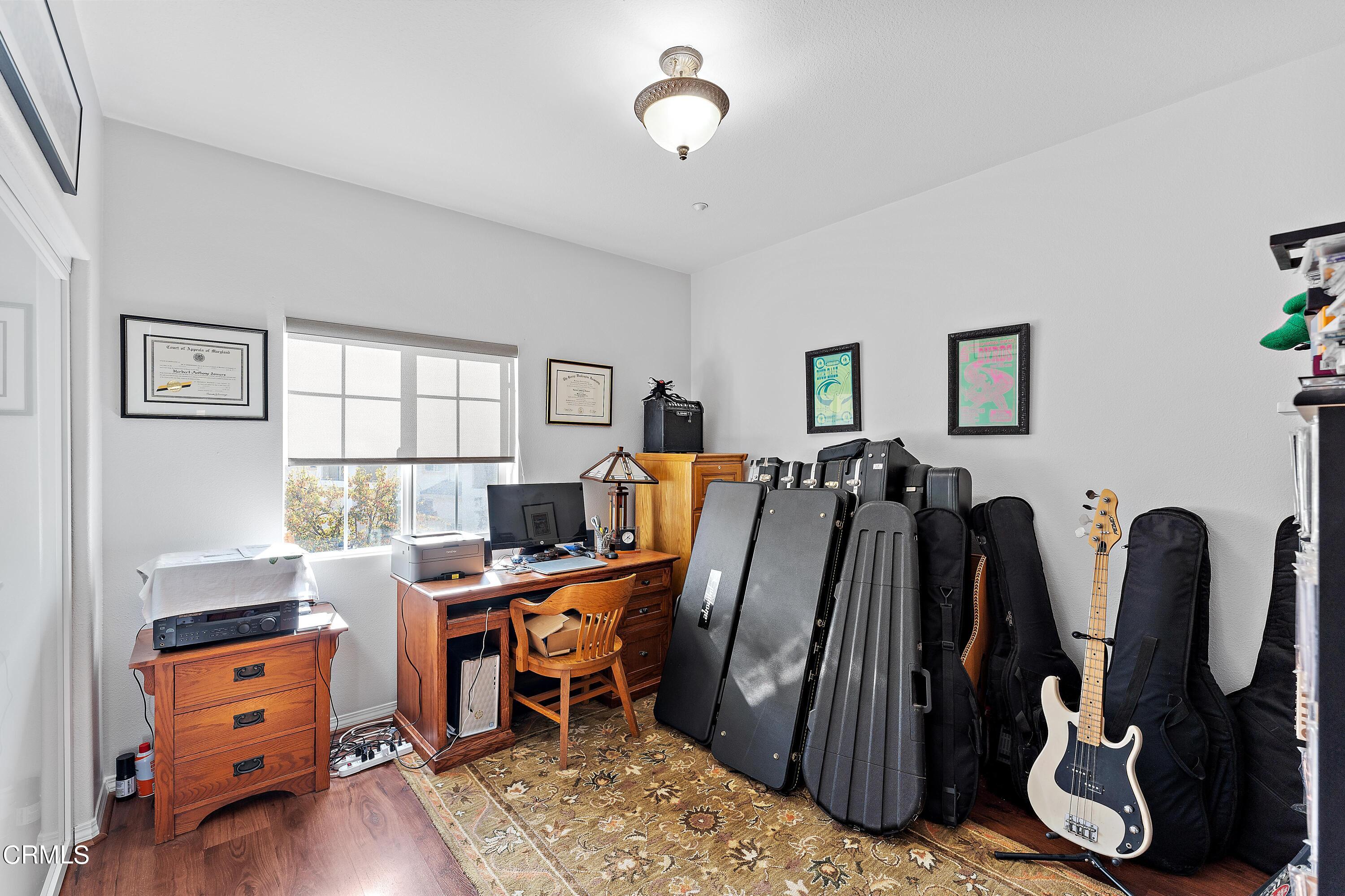 1239 Bayside Lane Oxnard, CA 93035 - Photo 16 of 27 a view of a room with gym equipment