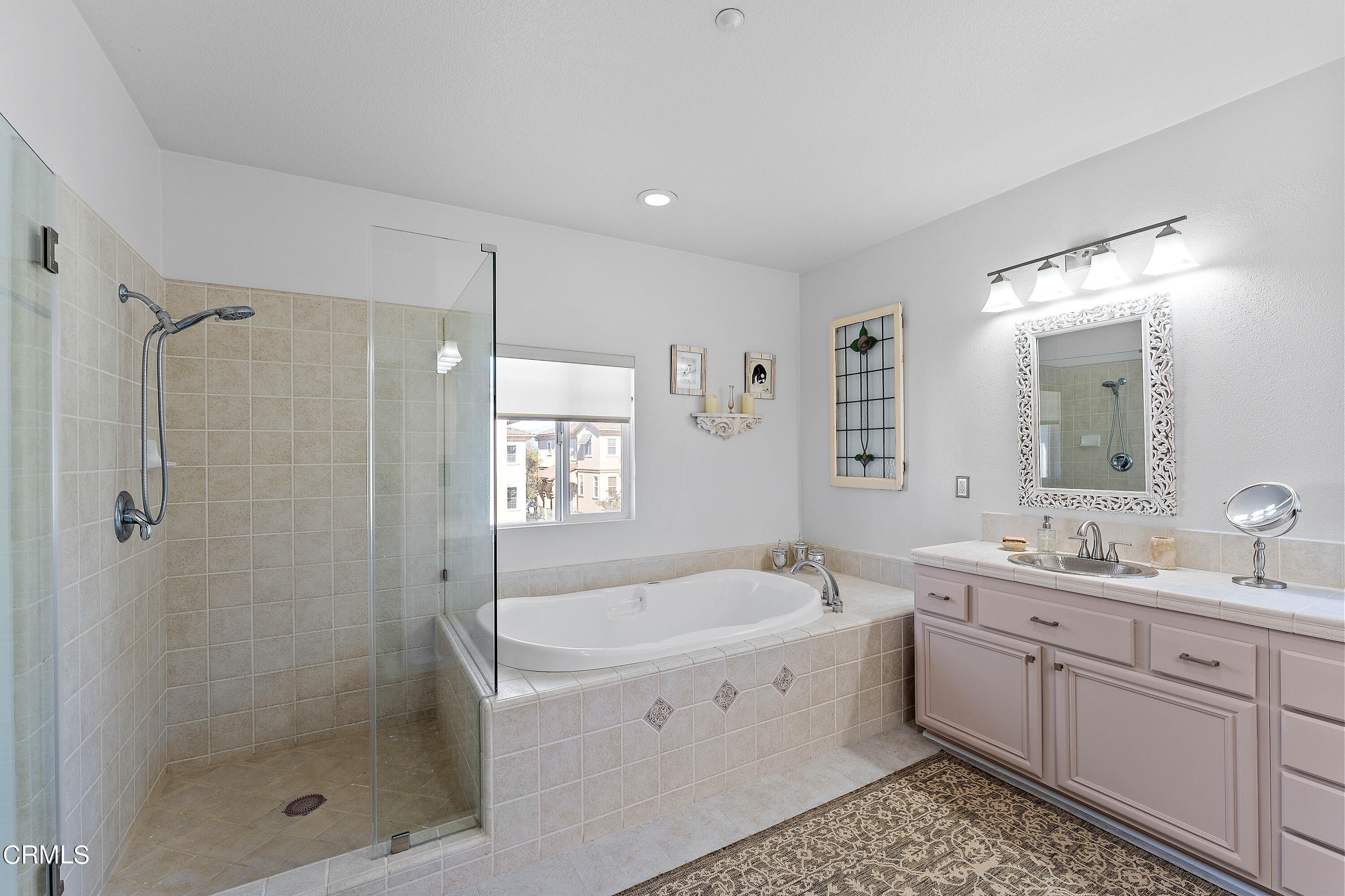 1239 Bayside Lane Oxnard, CA 93035 - Photo 20 of 27 a bathroom with a bathtub shower sink mirror and double