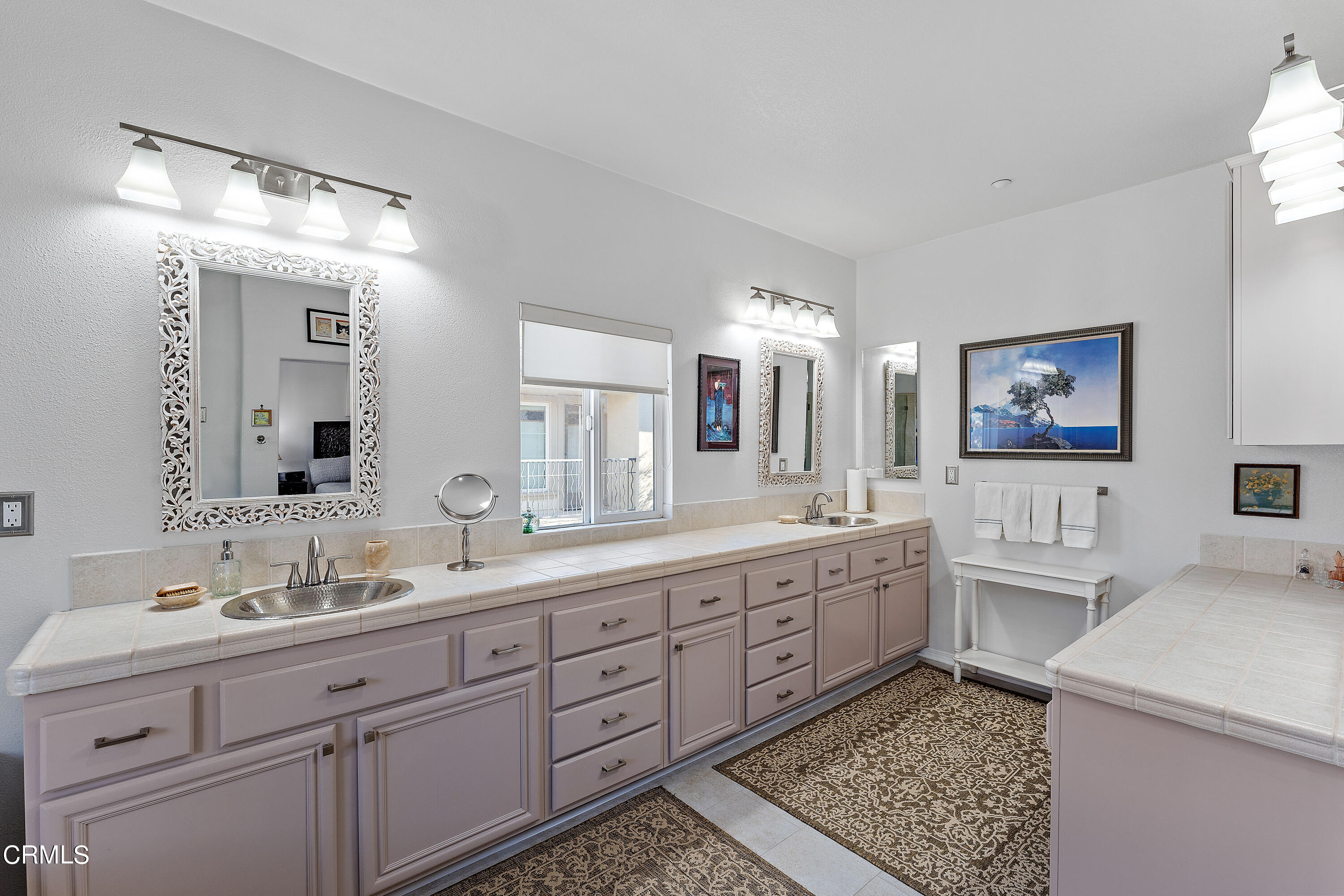 1239 Bayside Lane Oxnard, CA 93035 - Photo 21 of 27 a spacious bathroom with double sink and a mirror